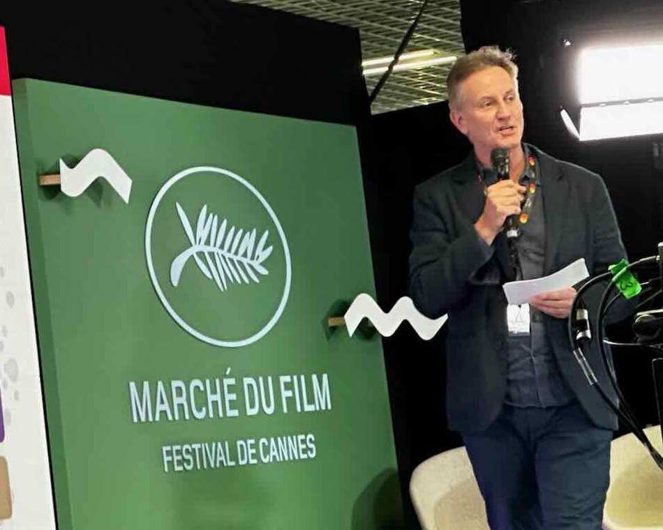 Steve Dodsworth pitching on stage at the Marché du Film, Cannes, 2025
